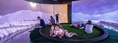 Children in the 360° mapping room at the OKO Fairy Tale and Animation Centre